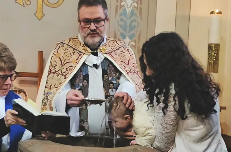 baby getting baptized